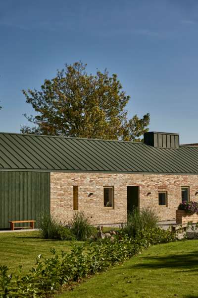 Green steel profiles set the framework for a rural family collective, Ølbyvej 178, 4623 Lille Skensved, Denmark